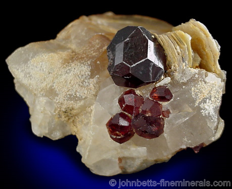 Spessartine Crystals on Quartz